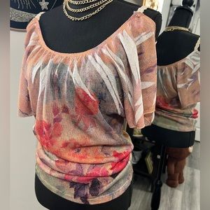 Floral off shoulder shirt.